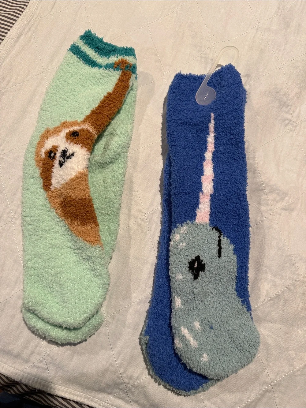 Sloth and Narwhal cozy socks